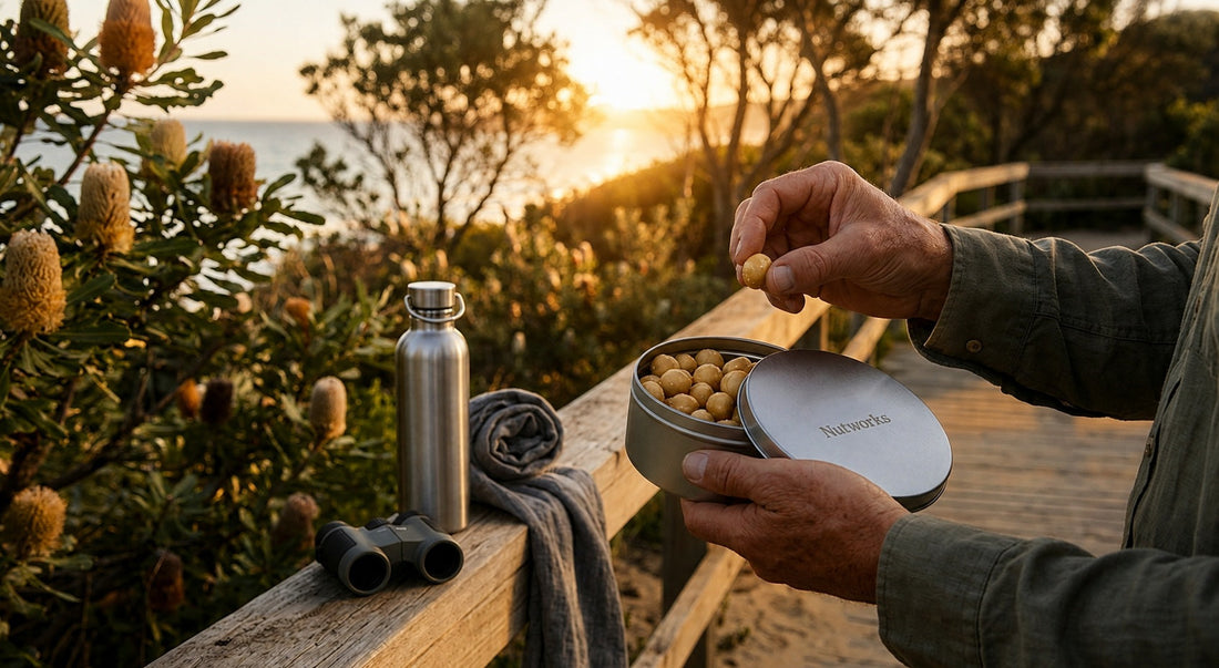 A person having a break to eating some macadamia nuts with a ocean view