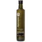 A bottle of macadamia oil 500 ml with a label that includes the brand name 'Nutworks' and the product name 'Macadamia Oil'. The bottle is dark glass with a white label and green text.