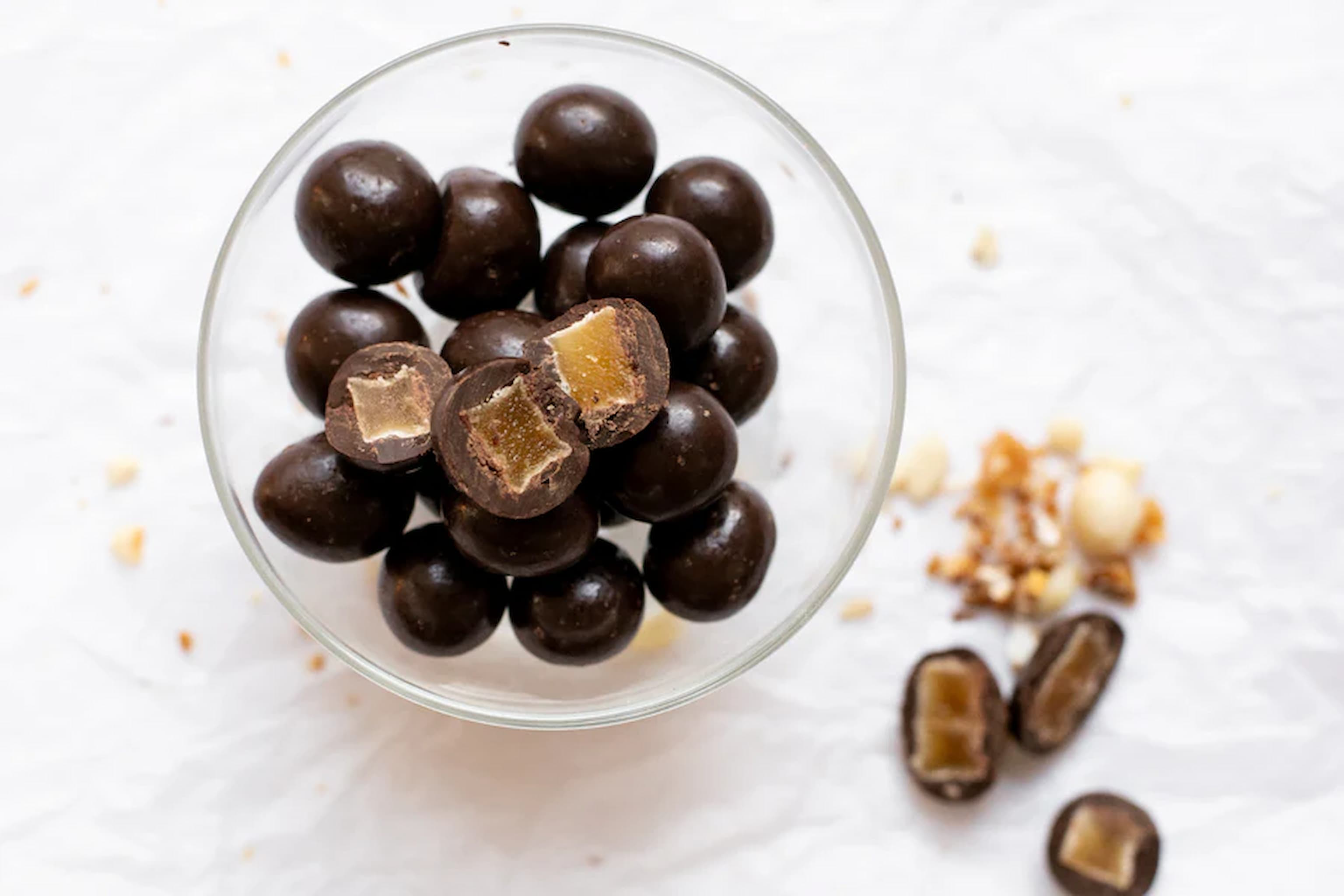 Dark Chocolate balls with ginger inside in a bowl photo Nutworks