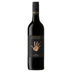 A bottle of Handpicked Barossa Valley Shiraz wine with a black label featuring a hand illustration.