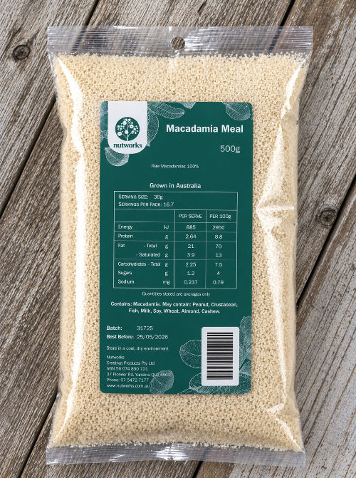 Package of macadamia meal with a green label on a wooden surface from Nutworks