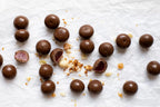 Milk Chocolate raspberry with nuts on a white surface photo from Nutworks