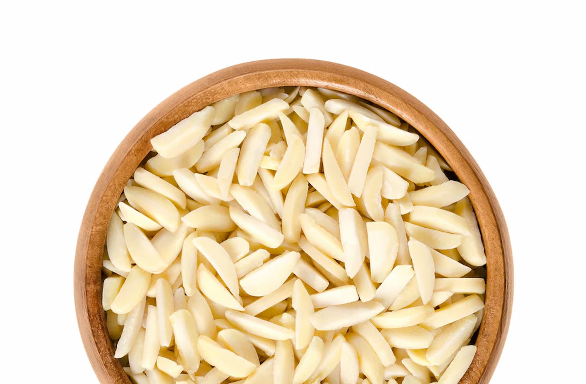 Wooden bowl filled with slivered almonds on a white background photo from Nutworks