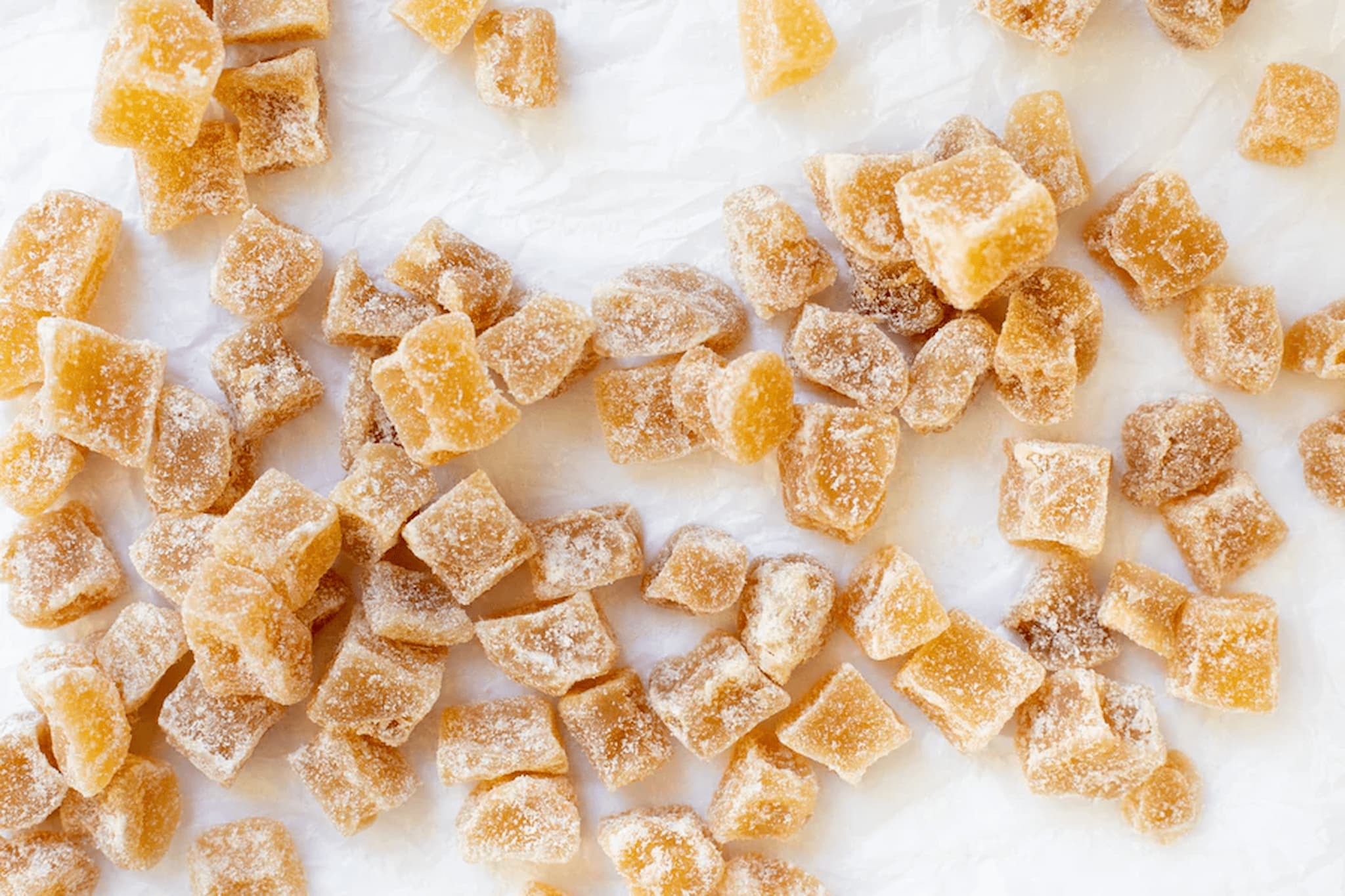 Gummy ginger chunks candy pieces on a white background