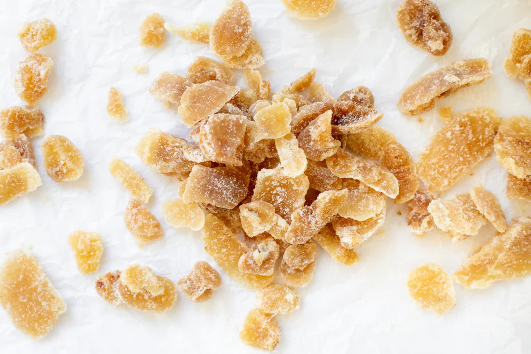 Dried ginger offcut pieces on a white background photo from Nutworks