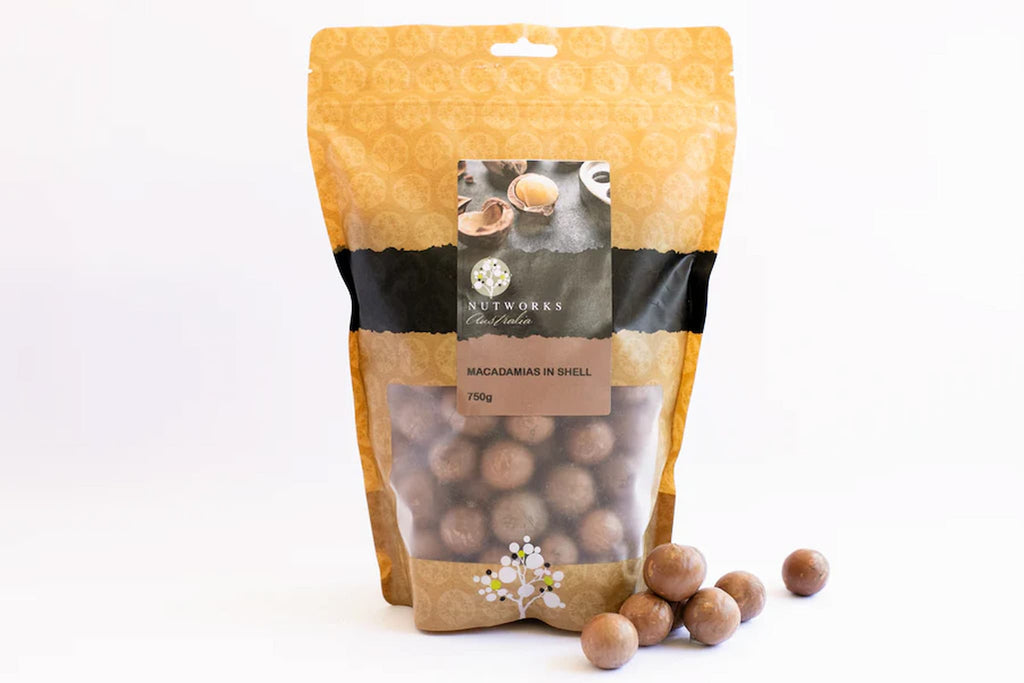 Bag of macadamias with visible brand logo on a white background 