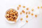 Manuka honey macadamias in a white bowl on a light background photo from Nutworks.